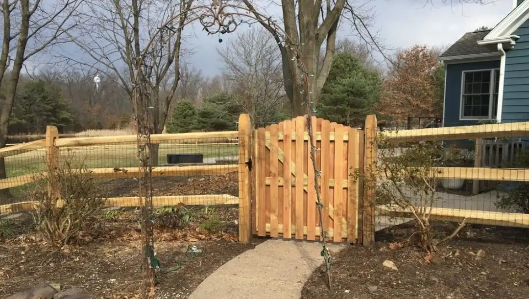Split rail fence with gate and wire