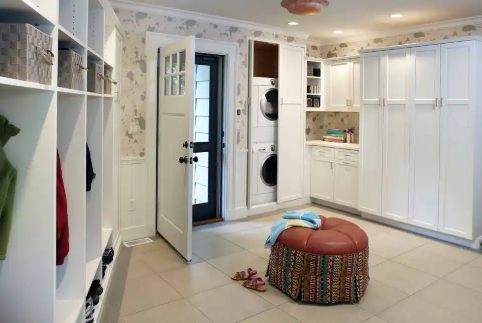 Stacked washer and dryer behind pocket doors