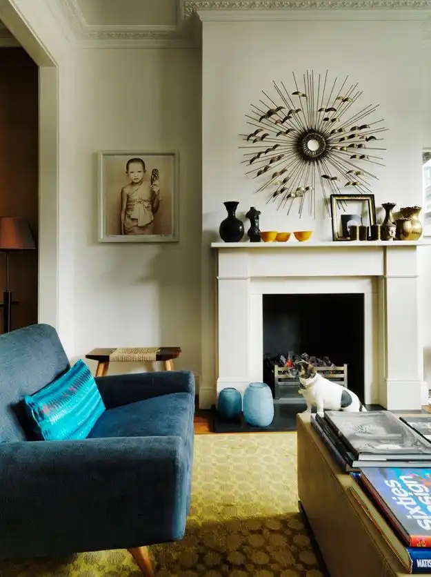 Sunburst art above fireplace