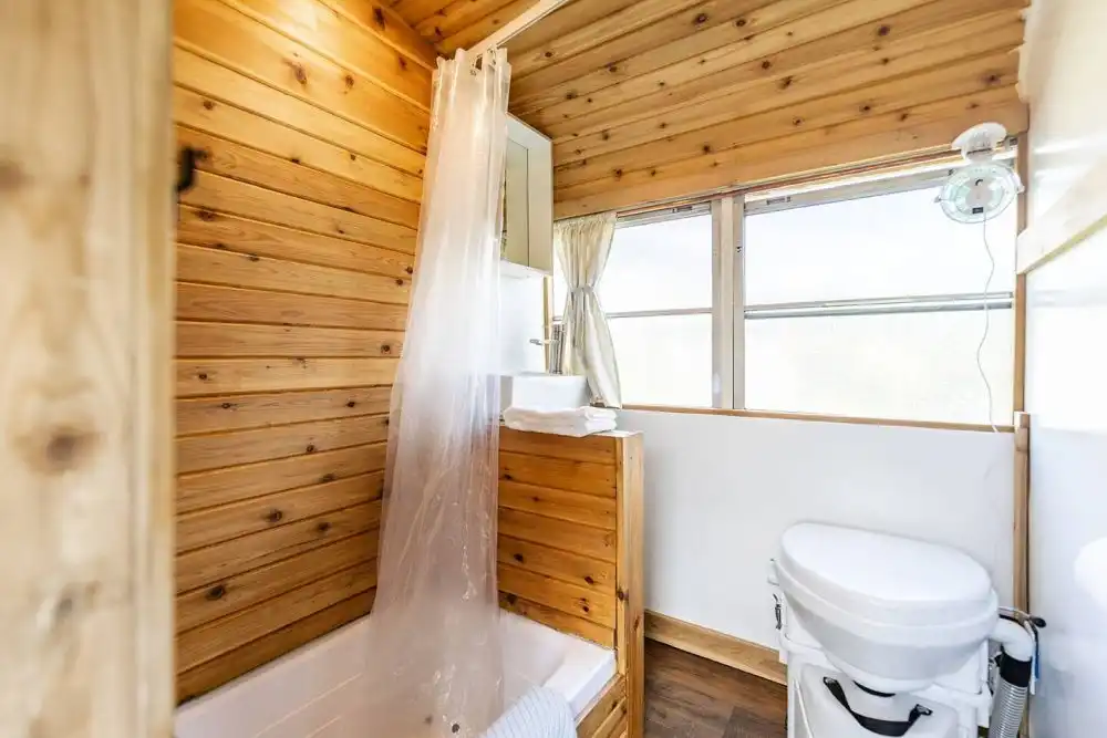 The Skoolie Romantic Urban Glamping bathroom