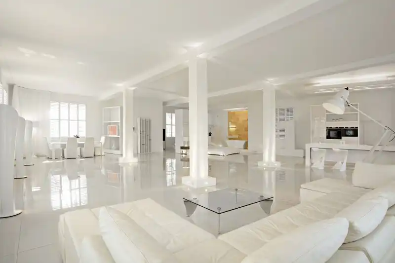 Use white furniture to emphasize the openness and airiness of an open plan living room