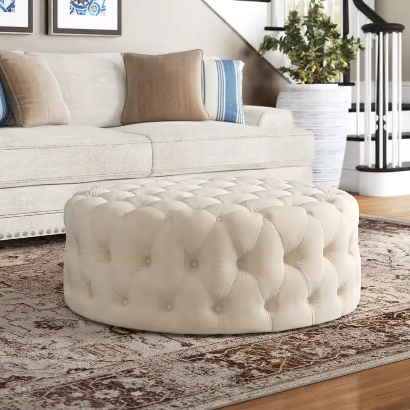 The round Huskins cocktail ottoman