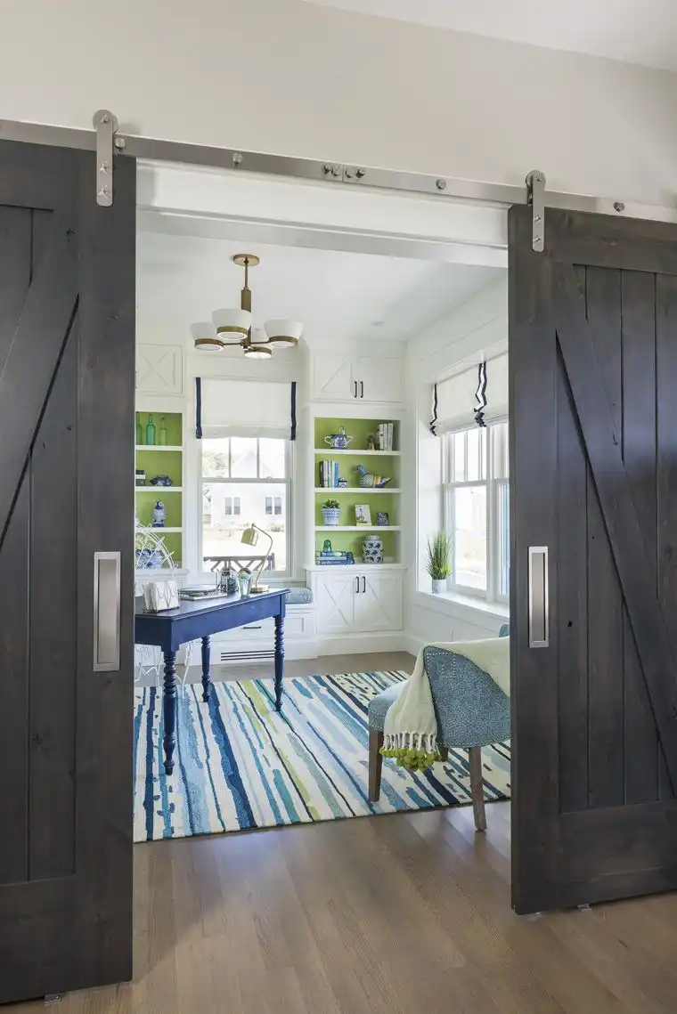This old classic shingle-style home - office barn doors