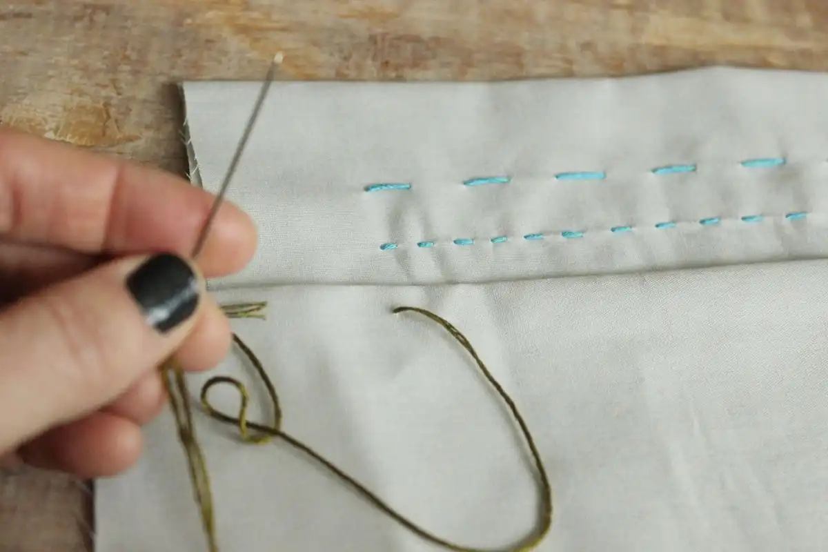 Thread the needle and knot