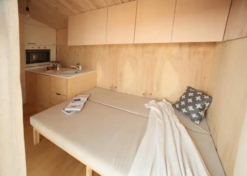 Tiny vacation home on wheels bed