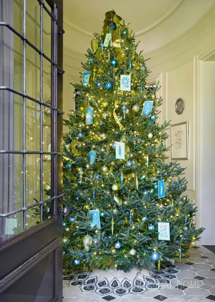 Traditional home with large entryway tree and blue accents