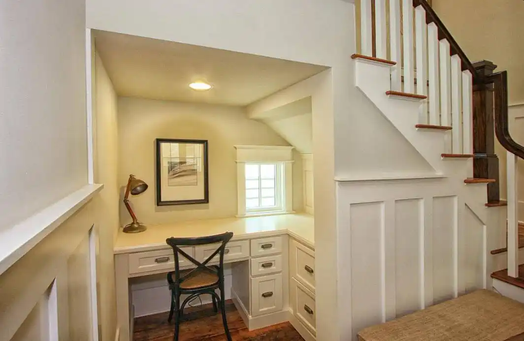 Traditional under the stairs desk area