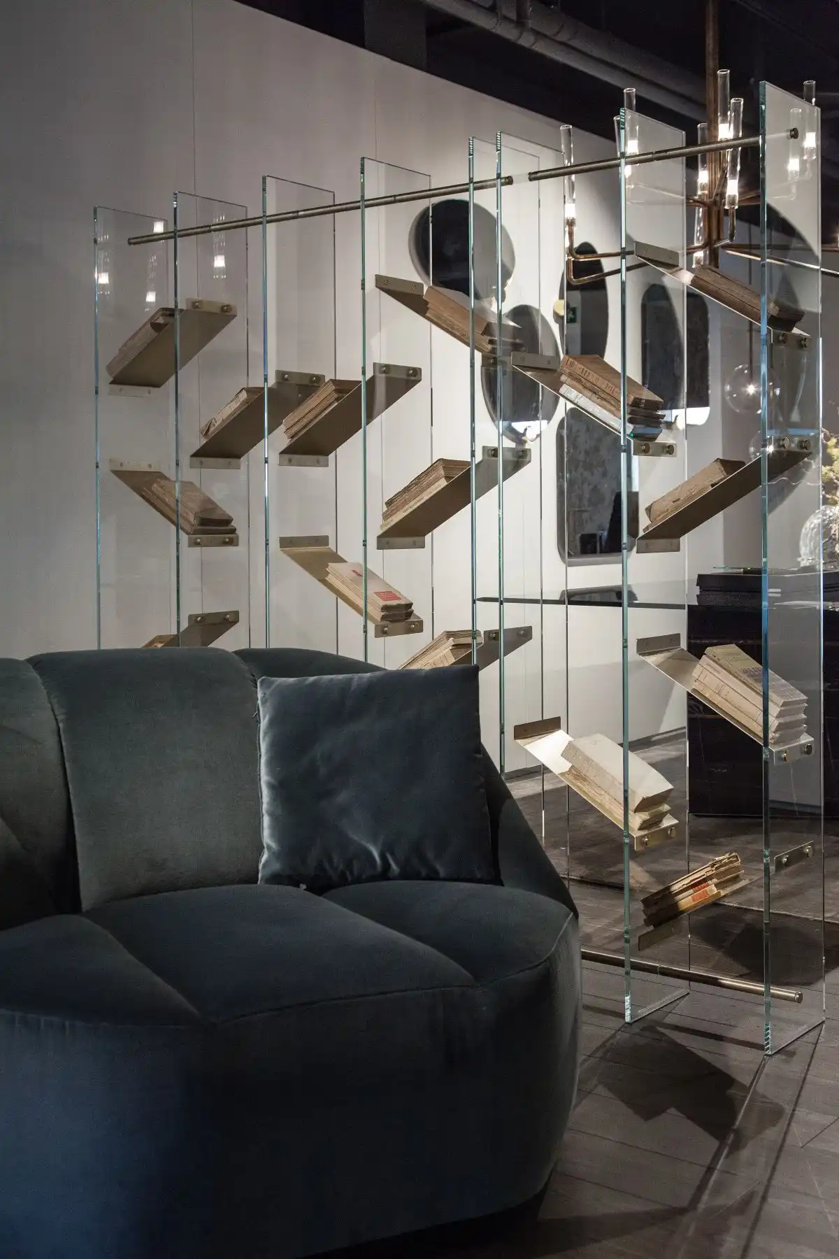 Transparent library used like divider glass shelves