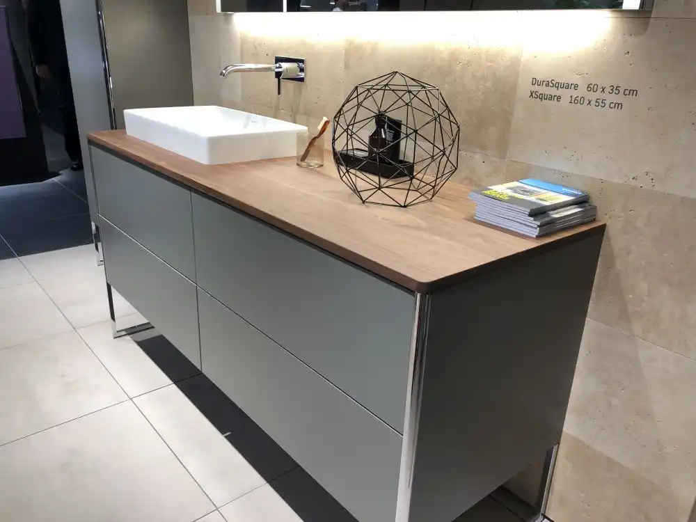 Travertine wall tiles and gray cabinet