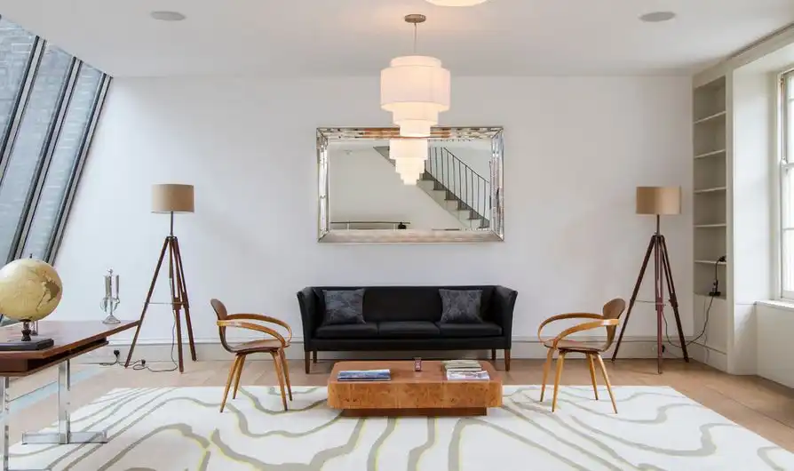 Tripod floor lamps placed in corners