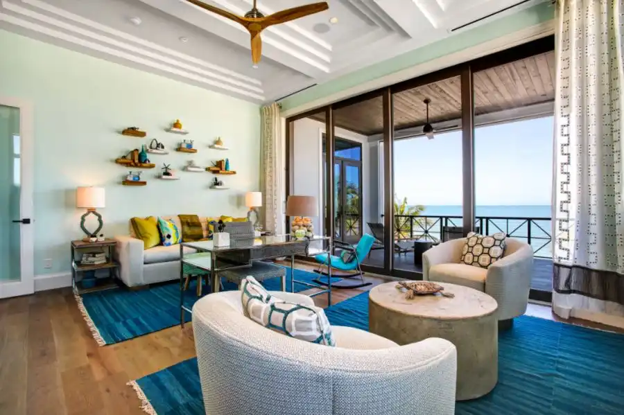 Tropical Family Room in Miami With Large Accent green mint wall
