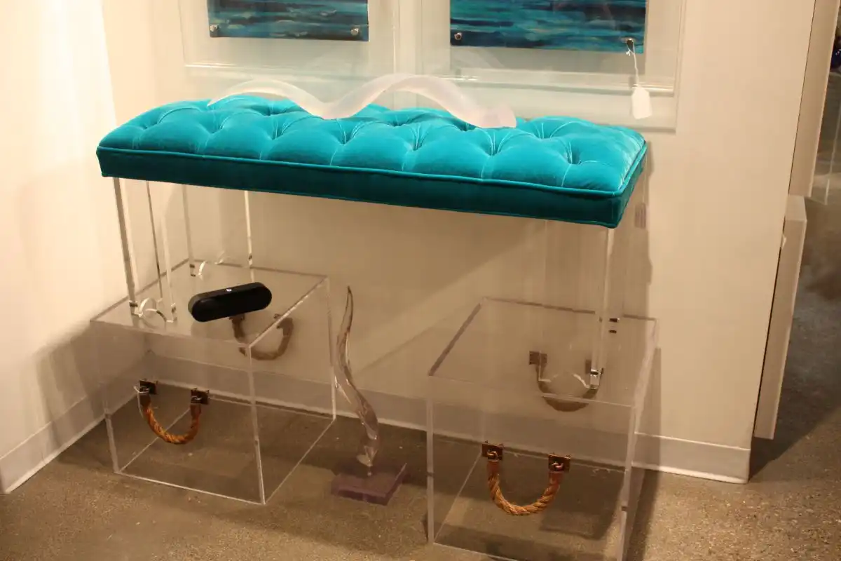 Tufted turquoise bench with acylic base and boxes