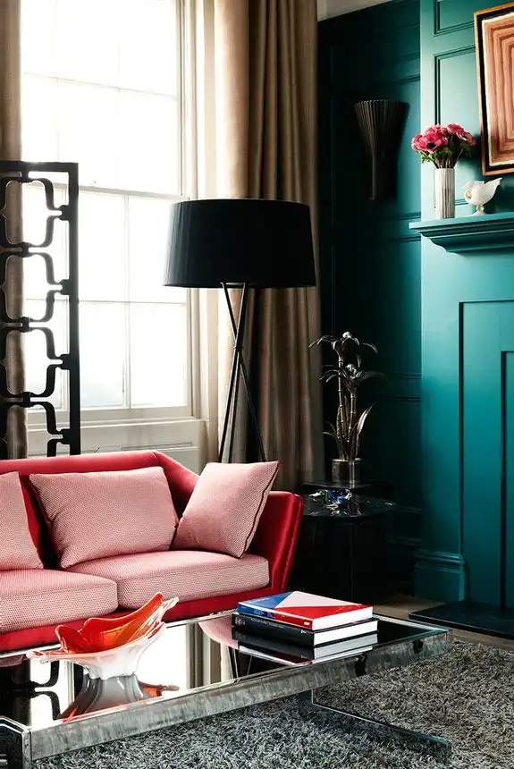 Turquoise walls and deep red sofa