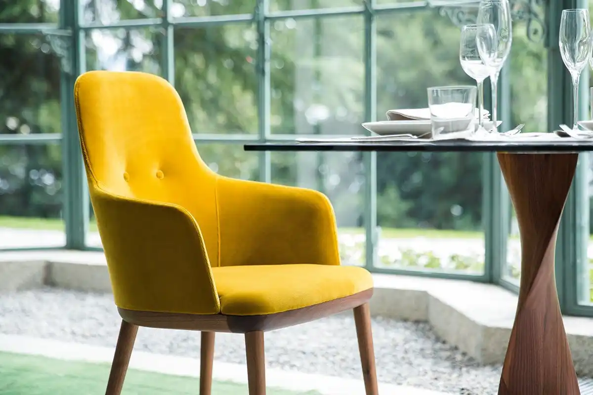 Upholstered yellow mustard chair from Connie