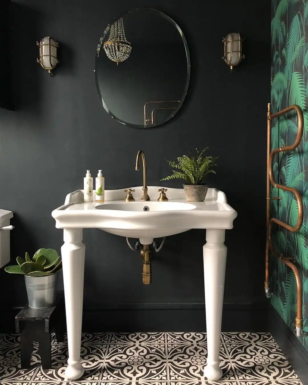 Vintage bathroom wall with green wallpaper