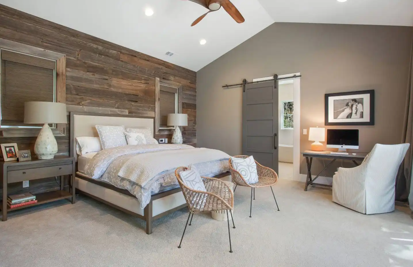 Wall paneling bedroom with gray sliding barn door