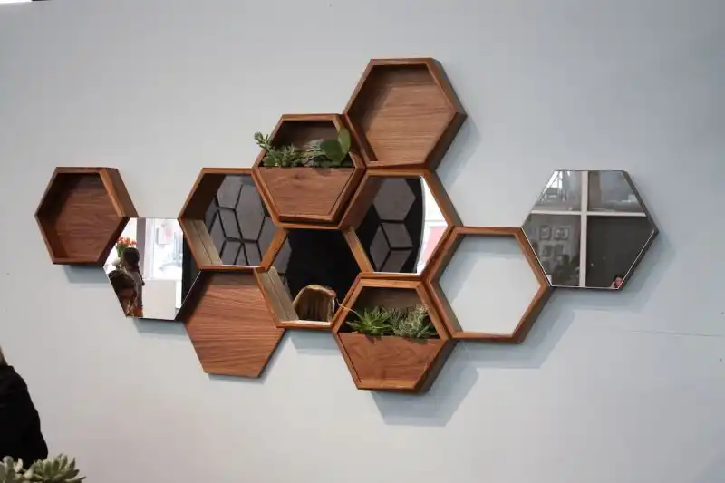 Think Fabricate's Wall-Nuts are a really fun concept. You can artfully arrange the different hexagons on the wall, according to whatever modules you want: shelving, mirrors, planters, etc.