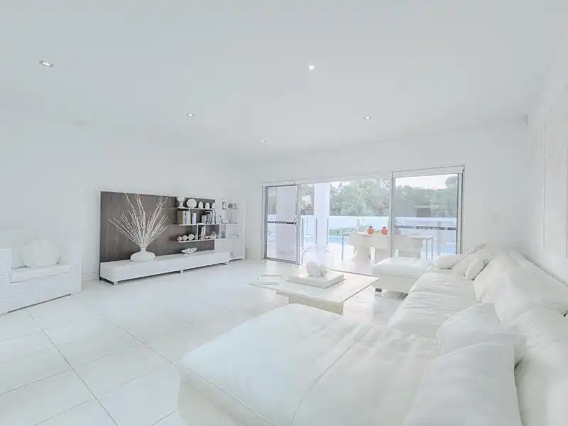 An all-white living room can end up looking cold and austere without a suitable palette of textures and finishes