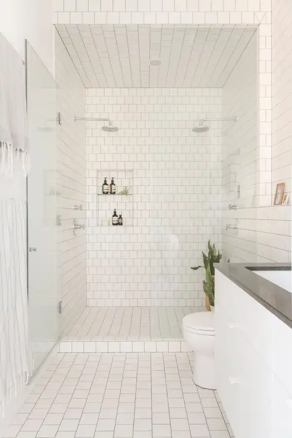 White bathroom design with a small shower niche