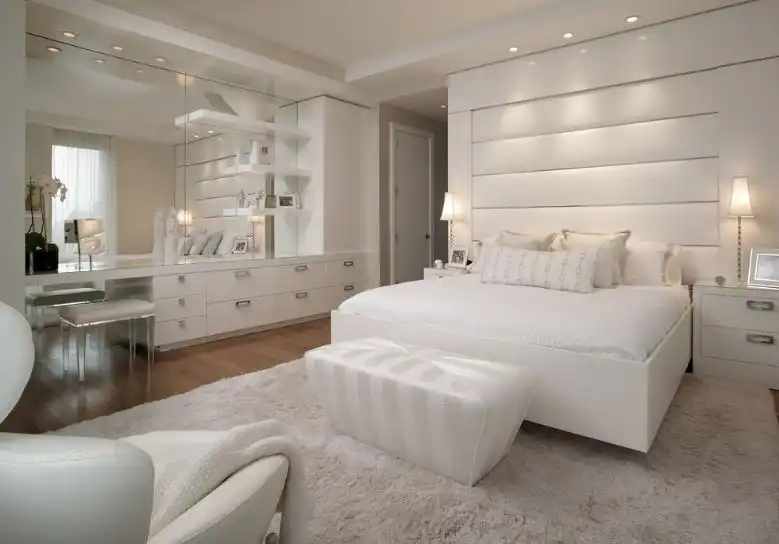 White bedroom design with dressing area