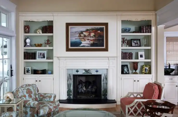 White built in bookcase around fireplace