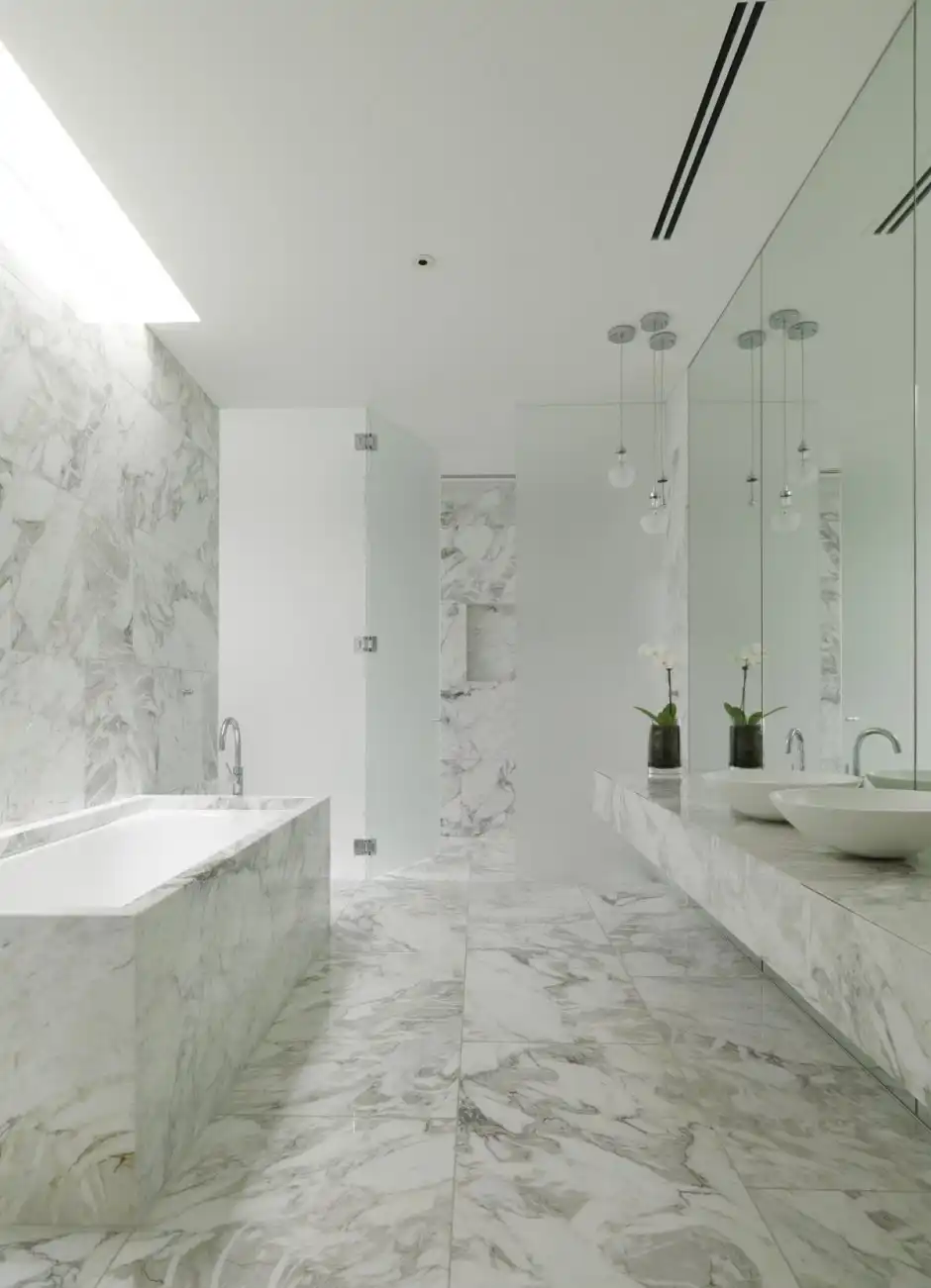 White marble bathroom design Seacombe Grove House by b.e architecture
