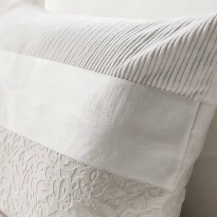 White patterned throw pillow
