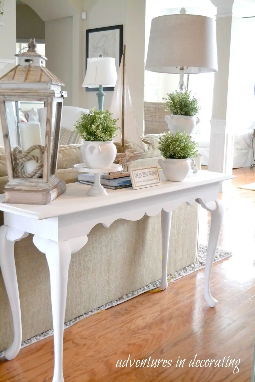 White table behind the sofa - french country decor