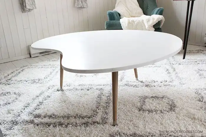 White top coffee table with mid century legs
