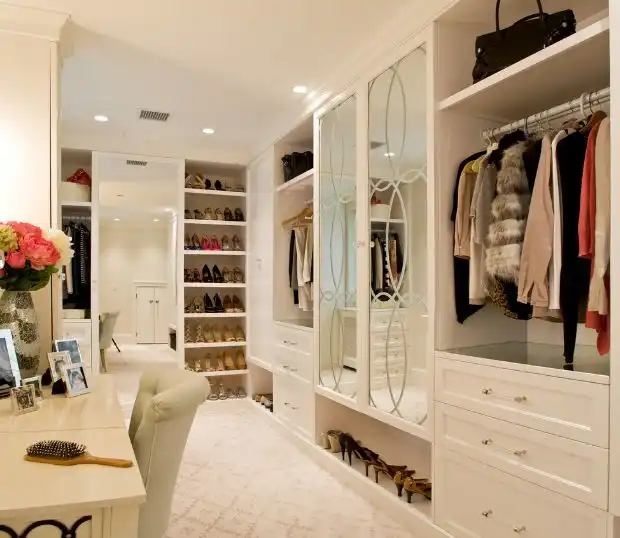 White walk in closet with dressing table