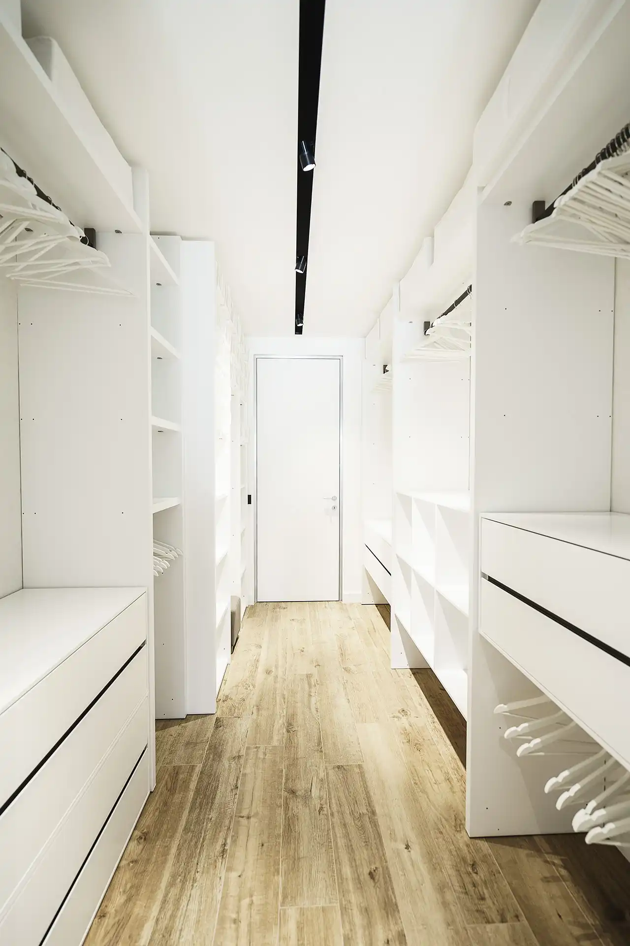 The closet is spacious and well organized.