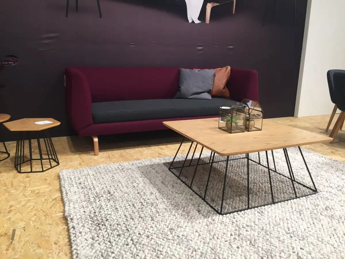 Wire base coffee table with purple sofa