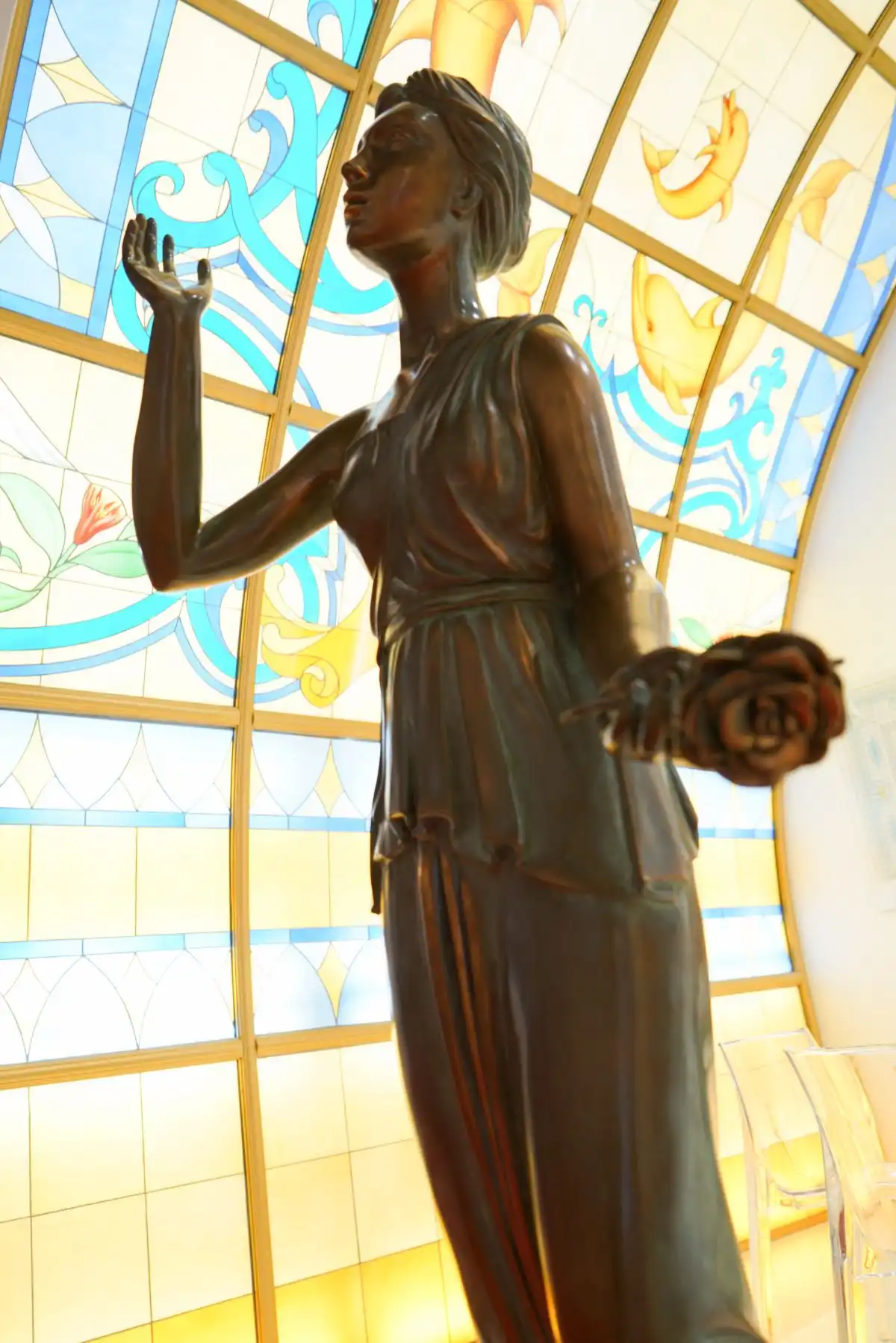 Woman with flower sculpture