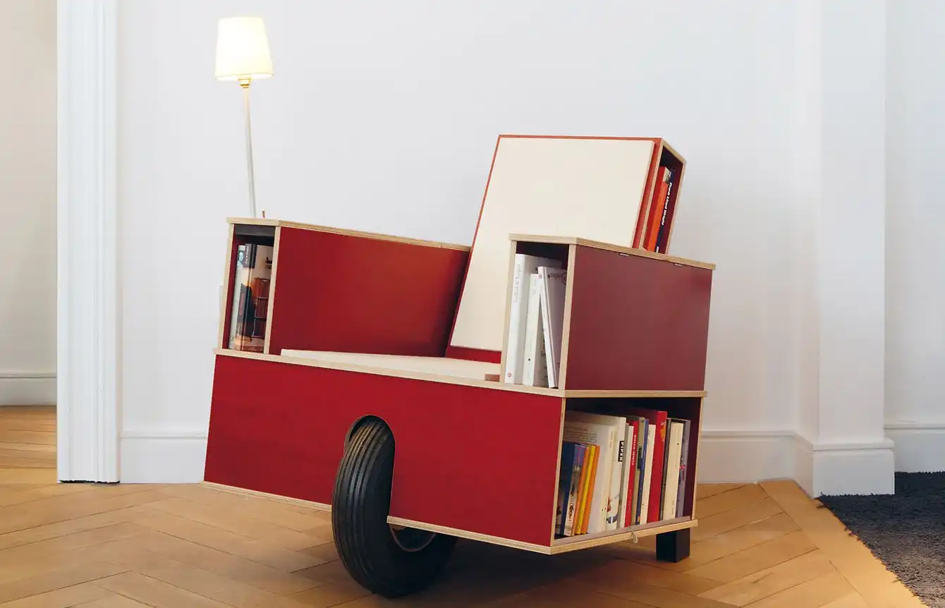 Wood chair on wheels with storage for magazine and books