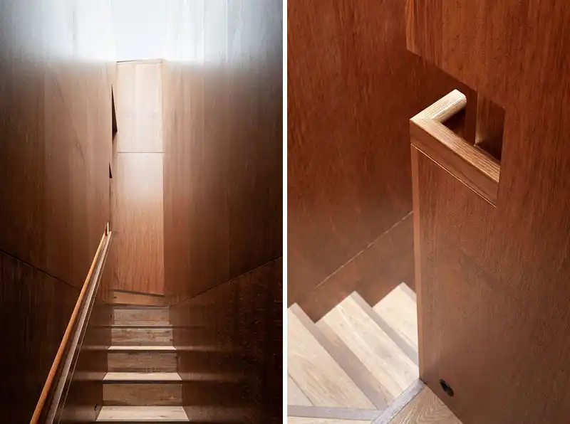 Wood paneling staircase wall and handrail