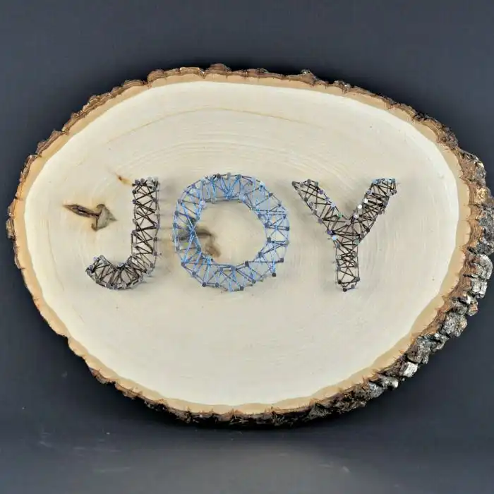 Wood slab string art