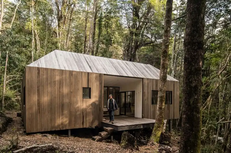 Wooden cabin on a remote site in the woods