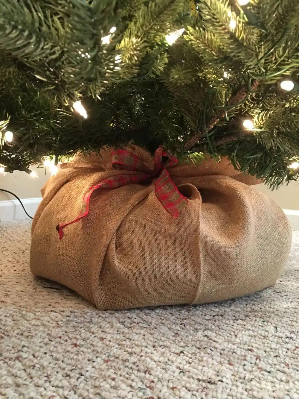 A pool noddle bundled up inside a burlap sack