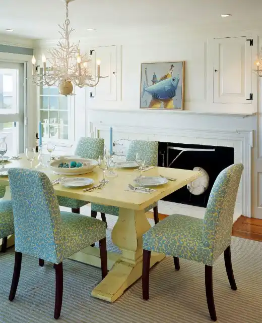 Yellow painted washed trestle dining table