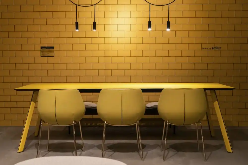 Yellow subway tiles and dining area