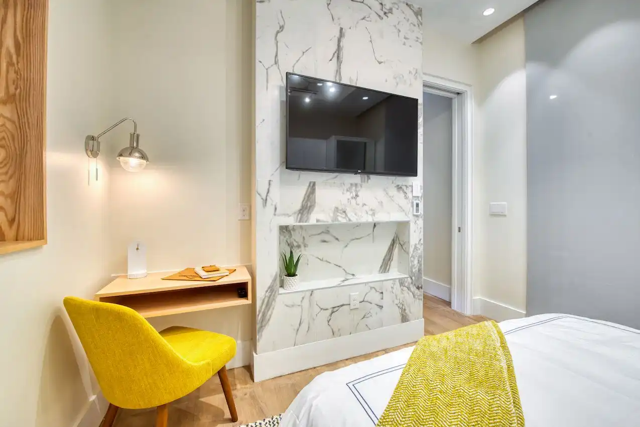 A light color palette with a pop of bright color makes it feel roomy.