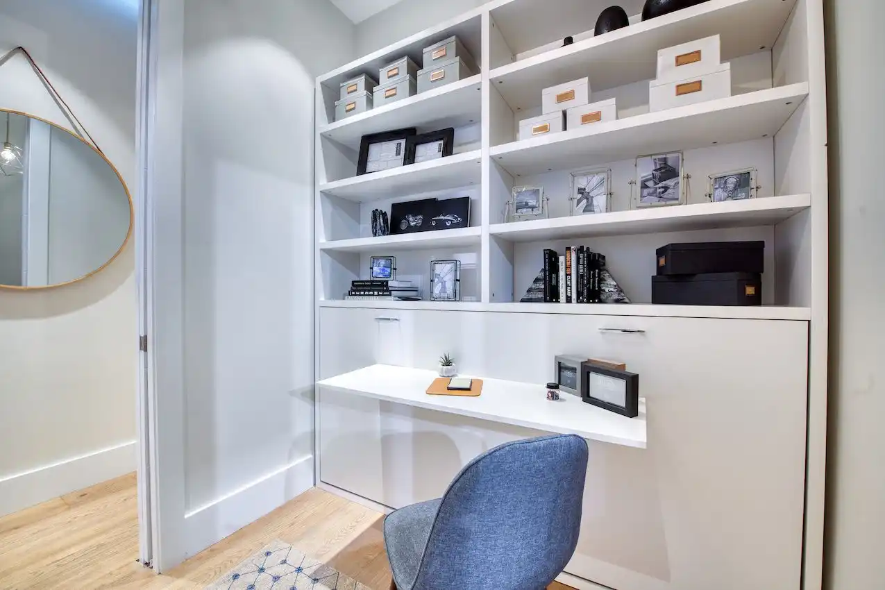 Space-saving pocket doors and a convertible desk increase the bedroom's function.