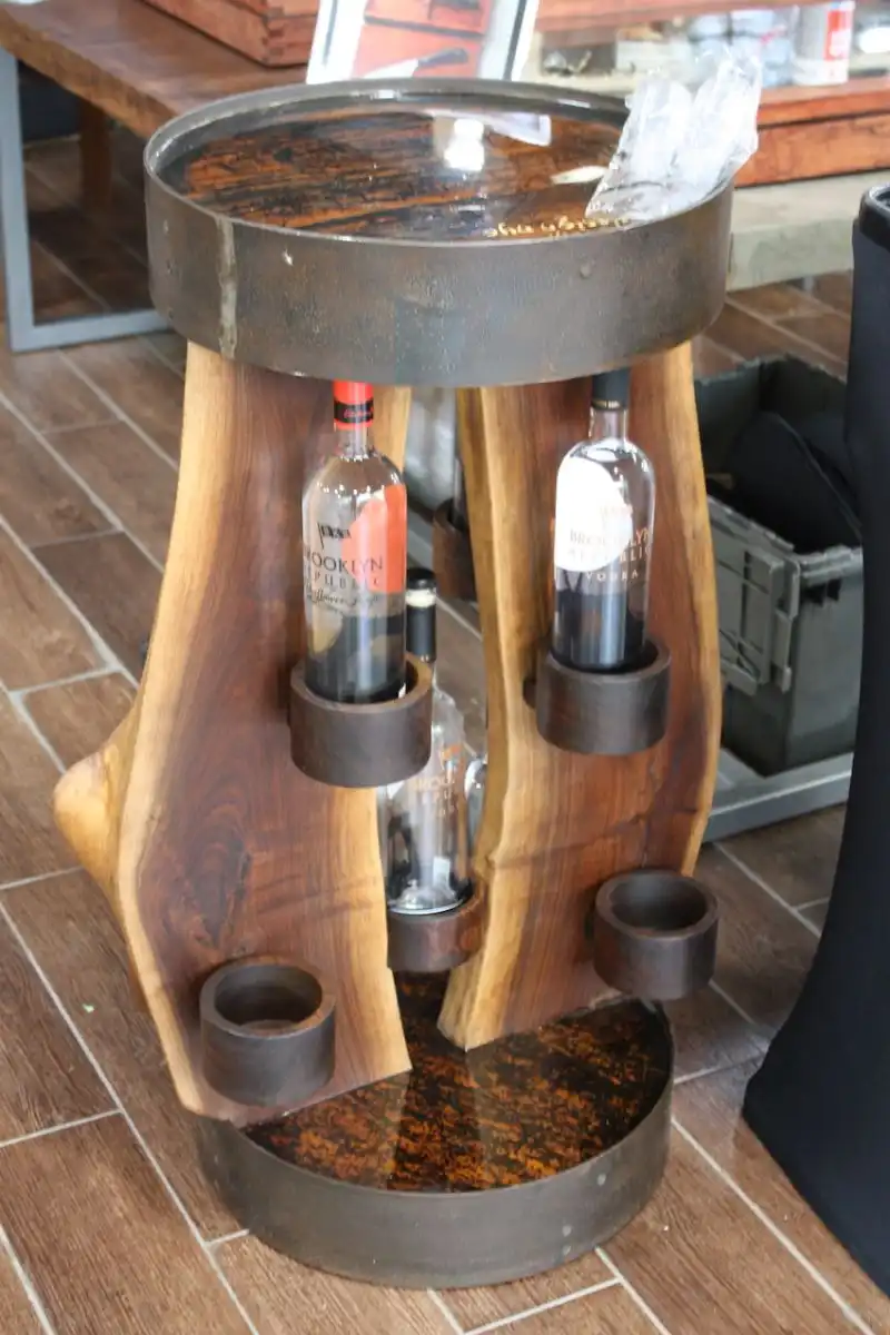 We've seen a lot of bar carts over the years, but Orent's live edge bar stand is quite different. Store your favorite bottles in the holders and mix up the cocktails right on the sunny wooden tabletop. So cool.