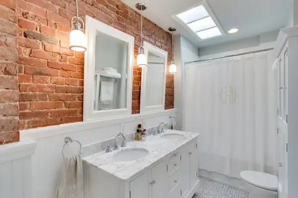 Bathroom with exposed bricks