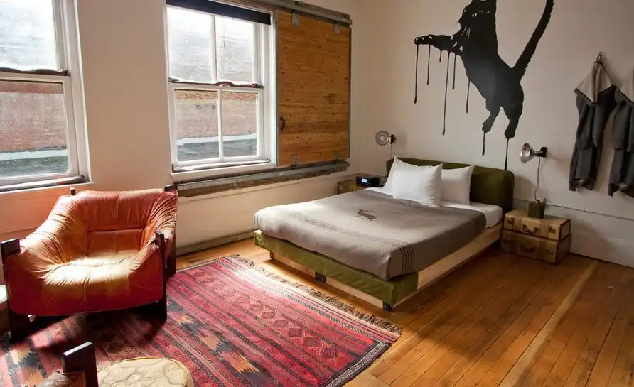 Bedroom featuring a wooden barn sliding for window