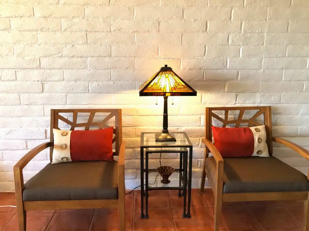Chairs on brick wall modern buyngalow 1024x768