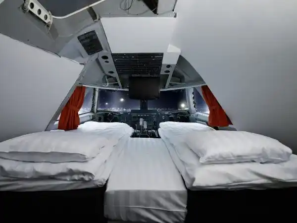 Check into the bedroom in the cockpit for a great view of the night sky