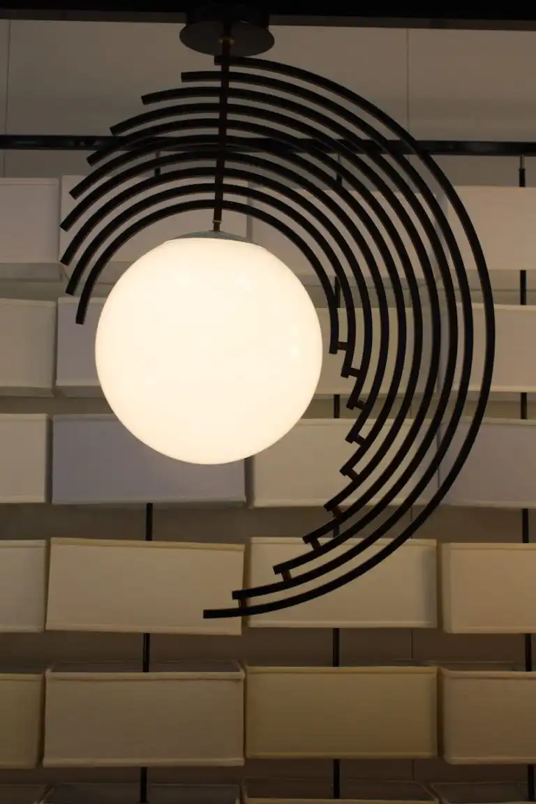 The partial rings around the globe shade are an atypical construct for the fixture.