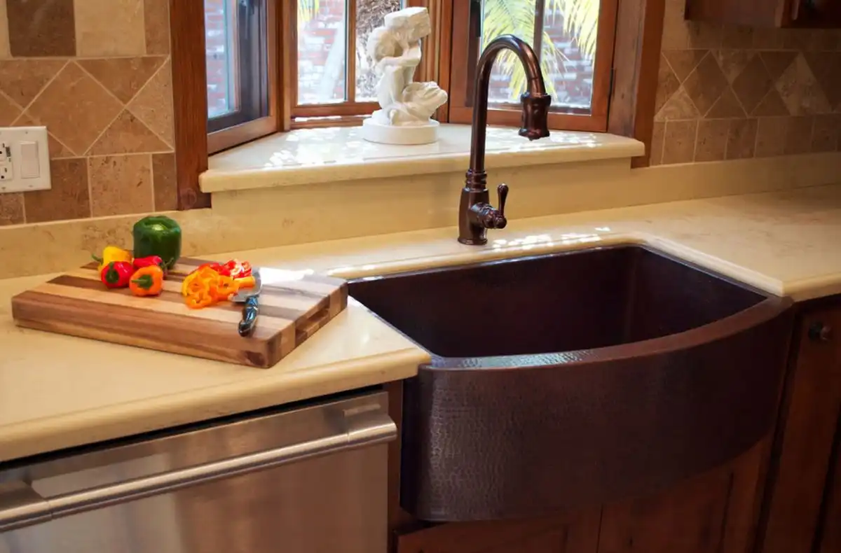 copper-farmhouse-sink-and-matching-faucet