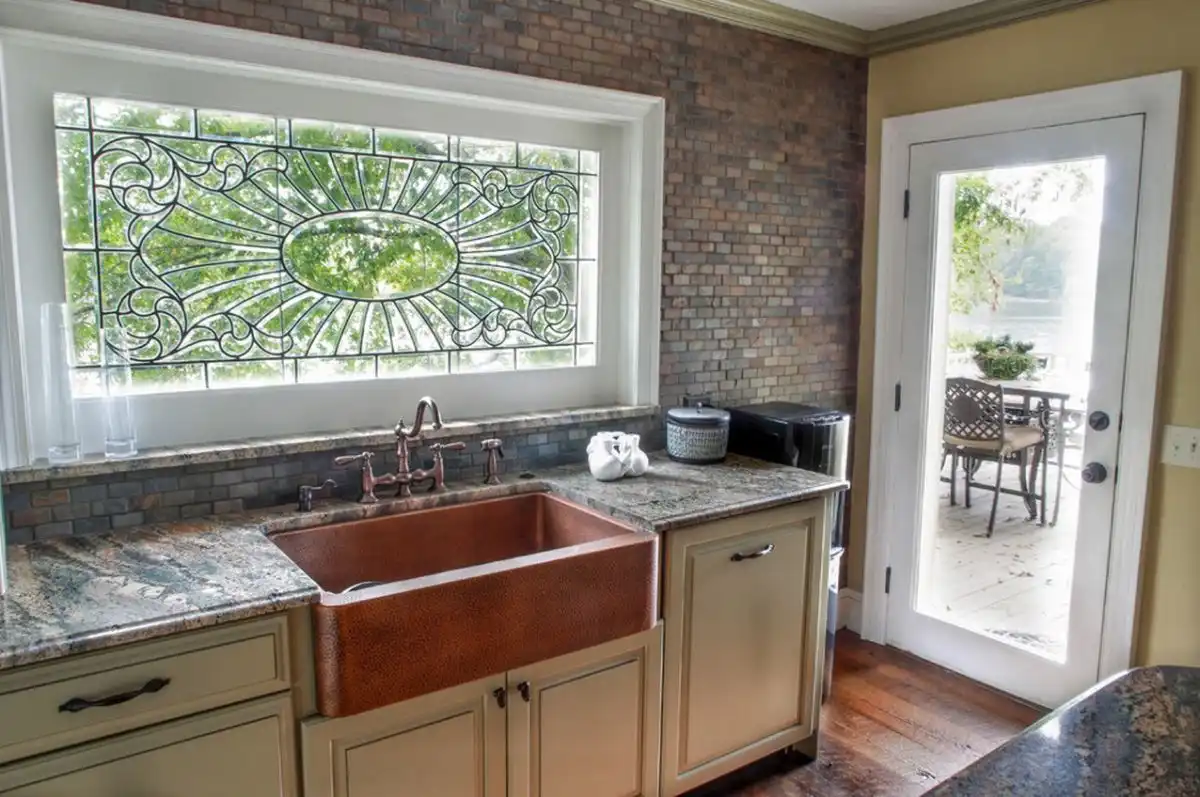 copper-sink-and-brick-wall